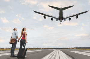 Happy Couple On Airport Runway With Plane Landing 2025 01 07 12 12 21 Utc - Barão Assessoria Contábil